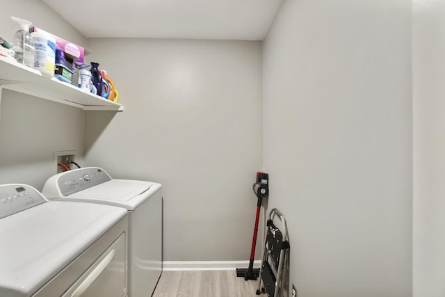 2433 Kennedy Ct Unit 2433, Franklin, TN 37064 - laundry room with washer and clothes dryer, light wood finished floors, and baseboards
