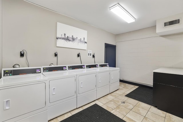 2433 Kennedy Ct Unit 2433, Franklin, TN 37064 - communal laundry room featuring washer and clothes dryer and light tile patterned flooring