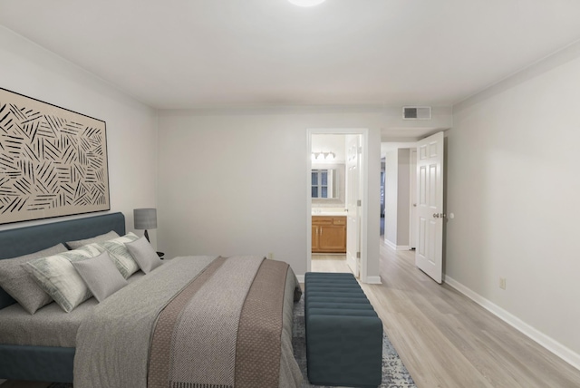 2433 Kennedy Ct Unit 2433, Franklin, TN 37064 - bedroom featuring light wood finished floors, ensuite bathroom, and baseboards