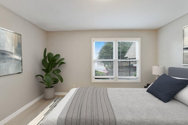 2433 Kennedy Ct Unit 2433, Franklin, TN 37064 - bedroom featuring baseboards and wood finished floors