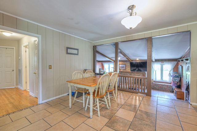 1111 Greenhill St, Murfreesboro, TN 37129 - dining space with ornamental molding, brick wall, and baseboards