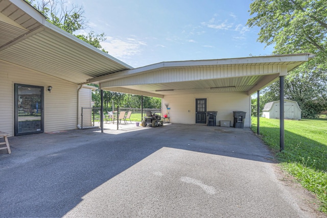 1111 Greenhill St, Murfreesboro, TN 37129 - view of parking / parking lot featuring driveway, a shed, and a carport