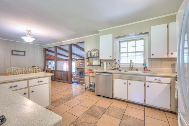 1111 Greenhill St, Murfreesboro, TN 37129 - kitchen featuring dishwasher, crown molding, light countertops, white cabinets, and wood walls