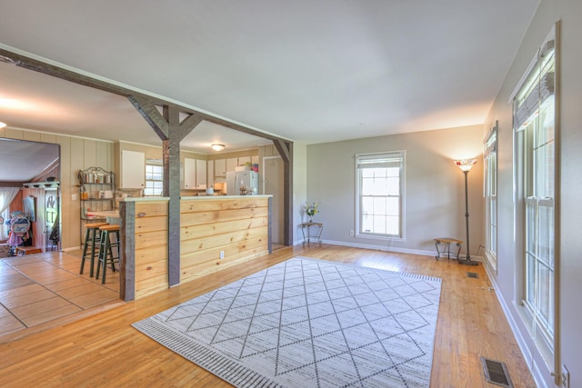 1111 Greenhill St, Murfreesboro, TN 37129 - unfurnished living room featuring light wood-style floors and baseboards