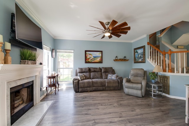237 Dandridge Dr, Franklin, TN 37067 - living room featuring a ceiling fan, wood finished floors, a premium fireplace, ornamental molding, and stairway