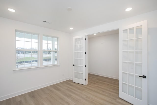 133 W Cassa Way, Mount Juliet, TN 37122 - spare room featuring french doors, light wood-style flooring, recessed lighting, and baseboards