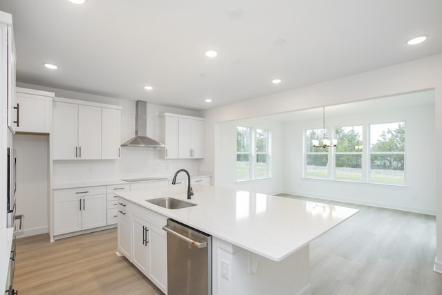 133 W Cassa Way, Mount Juliet, TN 37122 - kitchen featuring a sink, wall chimney range hood, stainless steel dishwasher, light wood-style flooring, and a chandelier