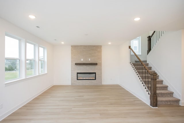133 W Cassa Way, Mount Juliet, TN 37122 - unfurnished living room featuring light wood-type flooring, stairway, and recessed lighting