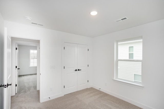 133 W Cassa Way, Mount Juliet, TN 37122 - unfurnished bedroom featuring light carpet, baseboards, and a closet