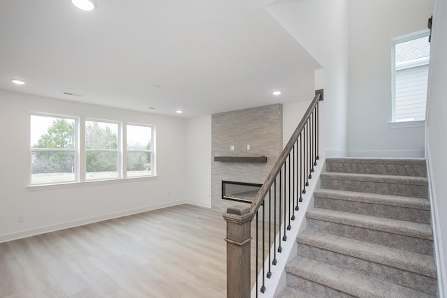 133 W Cassa Way, Mount Juliet, TN 37122 - staircase with healthy amount of natural light, recessed lighting, wood finished floors, a large fireplace, and baseboards