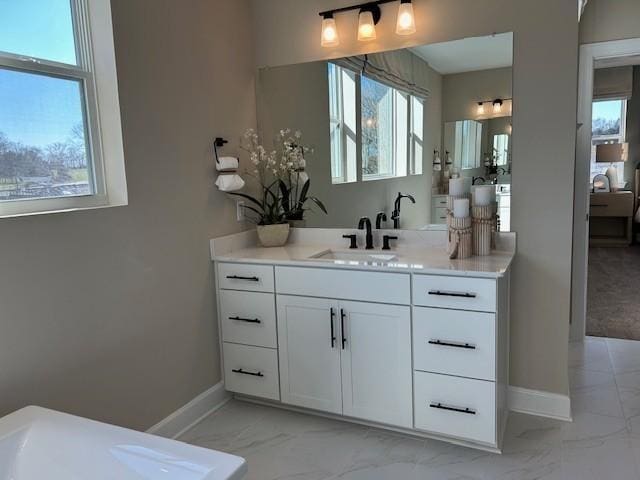 131 W Cassa Way, Mount Juliet, TN 37122 - bathroom with marble look tiles, baseboards, and vanity