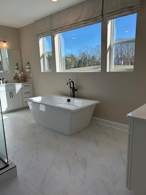 131 W Cassa Way, Mount Juliet, TN 37122 - full bath with vanity, a soaking tub, marble look tile flooring, and baseboards
