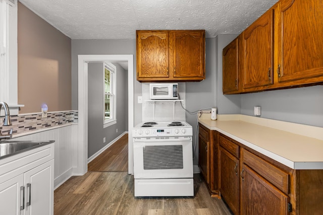1007 Birdsall St, Old Hickory, TN 37138 - kitchen with white appliances, a sink, dark wood-type flooring, light countertops, and a textured ceiling