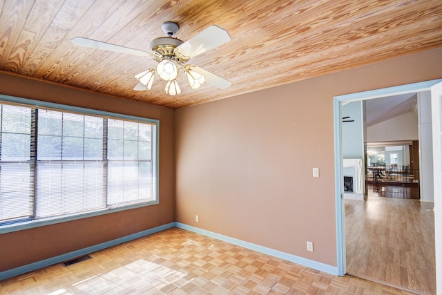 empty room featuring wooden ceiling, baseboards, and ceiling fan