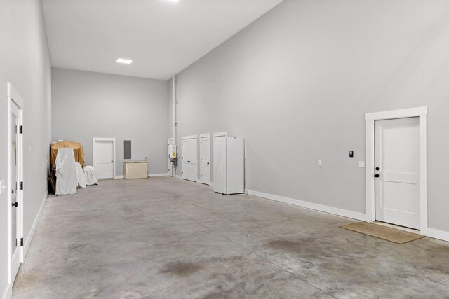 1440 Bowman Rd, Hixson, TN 37343 - spare room with concrete floors, a high ceiling, and baseboards