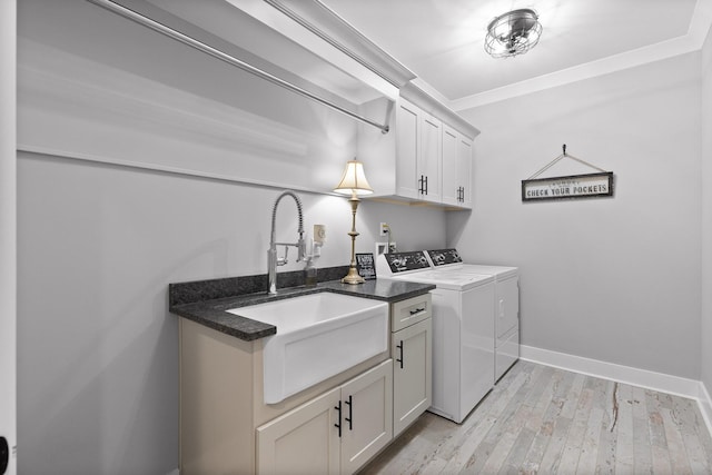 1440 Bowman Rd, Hixson, TN 37343 - laundry room featuring cabinet space, washer and dryer, light wood-style floors, and baseboards