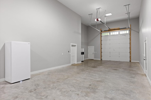 1440 Bowman Rd, Hixson, TN 37343 - garage featuring a garage door opener and baseboards