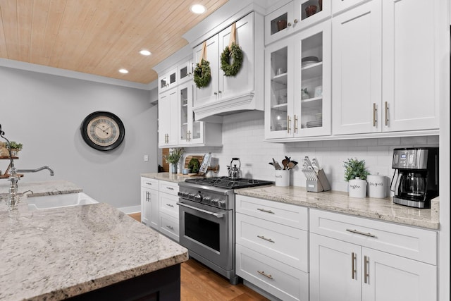 1440 Bowman Rd, Hixson, TN 37343 - kitchen with high end stainless steel range oven, recessed lighting, wooden ceiling, tasteful backsplash, and white cabinetry