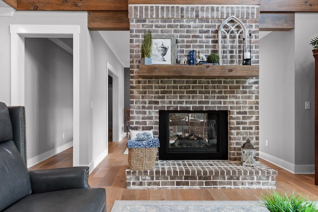 1440 Bowman Rd, Hixson, TN 37343 - detailed view of a brick fireplace, baseboards, and wood finished floors