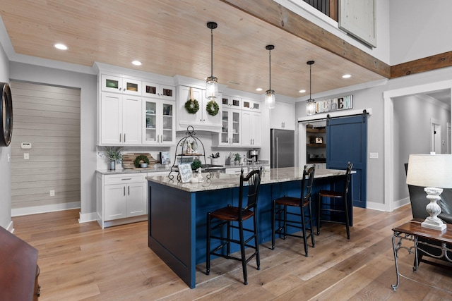 1440 Bowman Rd, Hixson, TN 37343 - kitchen with high end fridge, a barn door, wooden ceiling, light wood-style flooring, and recessed lighting