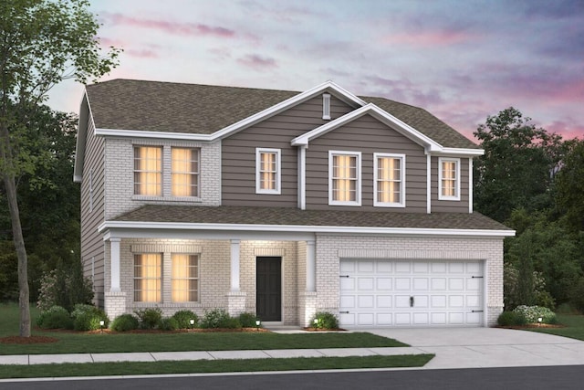 2436T Strong St, Columbia, TN 38401 - view of front facade with a garage, concrete driveway, brick siding, and a shingled roof