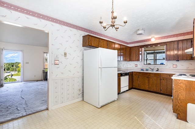1500 Rice Hill Ct, Antioch, TN 37013 - kitchen with white appliances, wallpapered walls, a sink, light flooring, and a chandelier