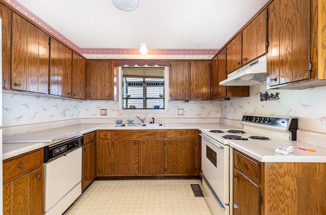 1500 Rice Hill Ct, Antioch, TN 37013 - kitchen featuring white appliances, under cabinet range hood, a sink, light floors, and brown cabinetry