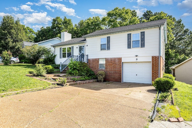 1500 Rice Hill Ct, Antioch, TN 37013 - split level home featuring brick siding, concrete driveway, an attached garage, a chimney, and a front lawn