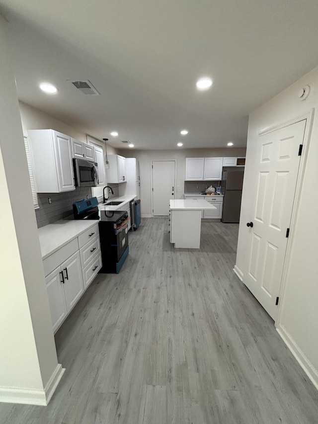 3221 New Towne Rd, Antioch, TN 37013 - kitchen featuring appliances with stainless steel finishes, a sink, baseboards, tasteful backsplash, and recessed lighting