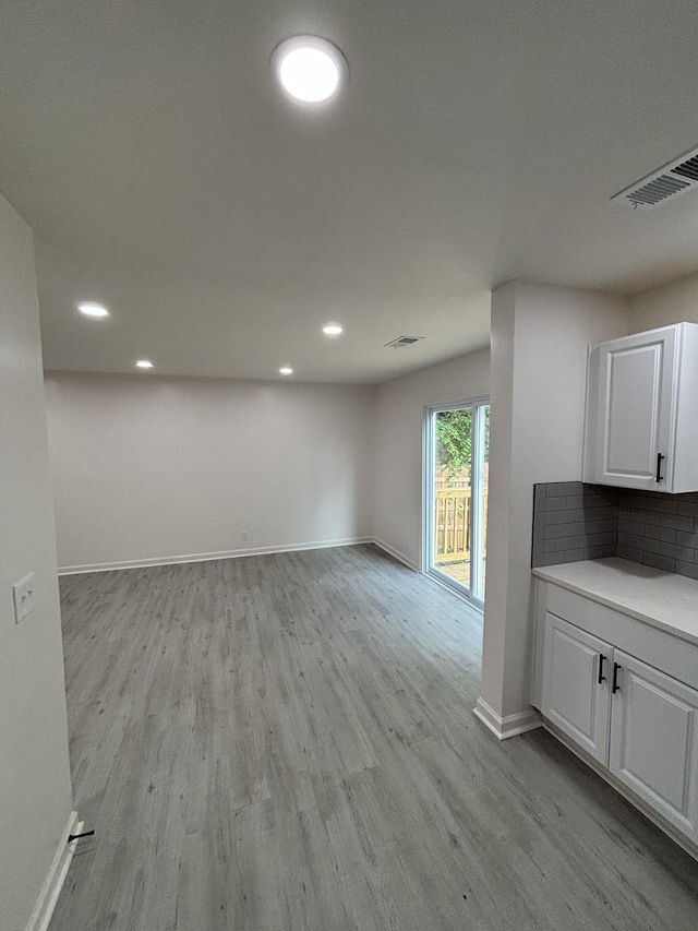 3221 New Towne Rd, Antioch, TN 37013 - unfurnished living room with light wood-style flooring, baseboards, and recessed lighting