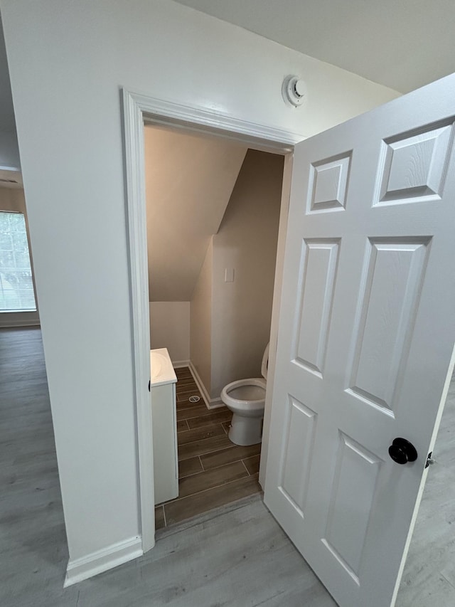 3221 New Towne Rd, Antioch, TN 37013 - bathroom featuring wood finished floors, baseboards, and toilet