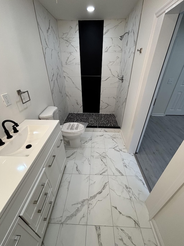 3221 New Towne Rd, Antioch, TN 37013 - full bathroom featuring tiled shower, marble look tiles, toilet, vanity, and recessed lighting