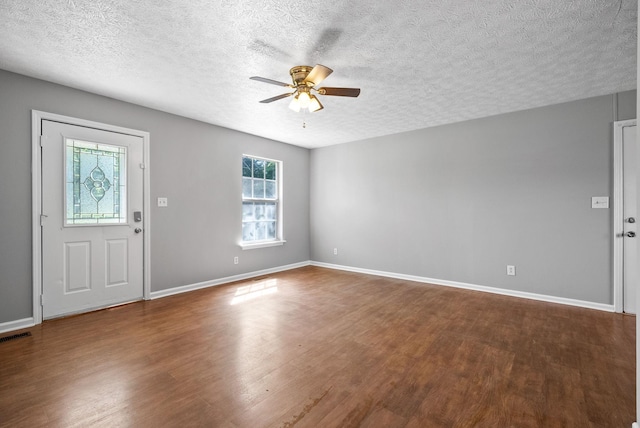 919 Linda Dr, Oak Grove, KY 42262 - foyer entrance with wood finished floors, a ceiling fan, a textured ceiling, and baseboards