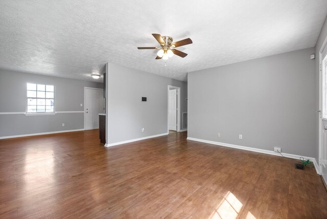 919 Linda Dr, Oak Grove, KY 42262 - unfurnished room with a ceiling fan, wood finished floors, baseboards, and a textured ceiling
