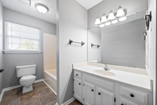 919 Linda Dr, Oak Grove, KY 42262 - bathroom with vanity, toilet, baseboards, and washtub / shower combination