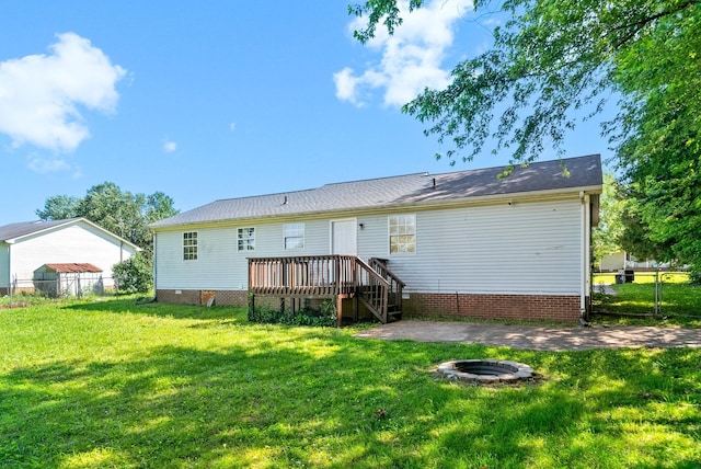 919 Linda Dr, Oak Grove, KY 42262 - rear view of house featuring a fire pit and a wooden deck