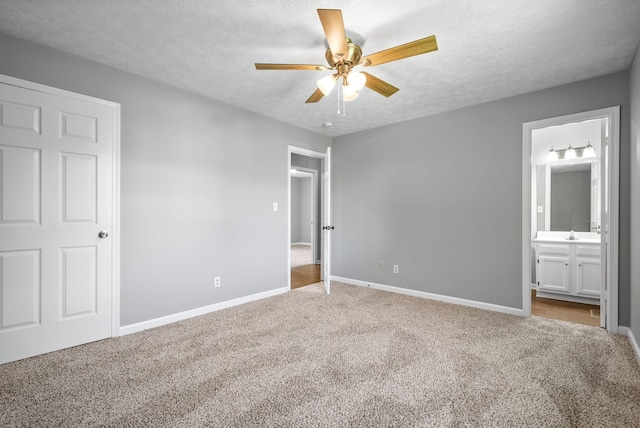 919 Linda Dr, Oak Grove, KY 42262 - unfurnished bedroom featuring carpet floors, a textured ceiling, baseboards, and ensuite bathroom