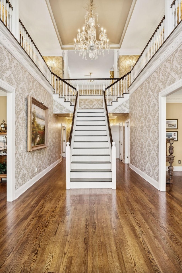 901 Fair St, Franklin, TN 37064 - stairway featuring ornamental molding, wallpapered walls, wood finished floors, a chandelier, and baseboards