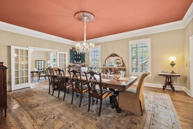 901 Fair St, Franklin, TN 37064 - dining space featuring a chandelier, crown molding, wood finished floors, french doors, and baseboards