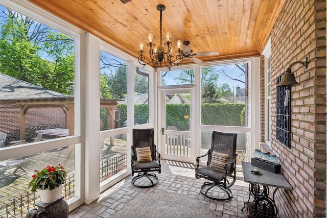 901 Fair St, Franklin, TN 37064 - sunroom featuring wooden ceiling, brick floors, brick wall, and a chandelier