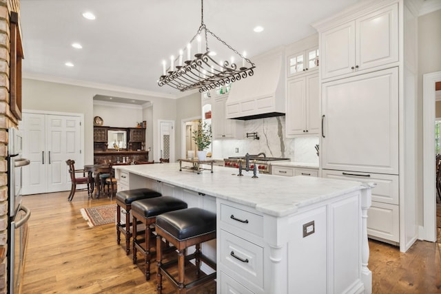 901 Fair St, Franklin, TN 37064 - kitchen with crown molding, recessed lighting, decorative backsplash, white cabinetry, and light wood finished floors