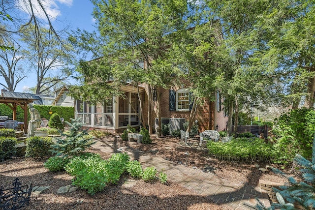 901 Fair St, Franklin, TN 37064 - rear view of house featuring a sunroom and brick siding