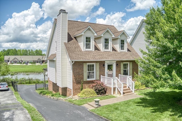 1461 Oxford Pl, Cookeville, TN 38506 - new england style home with a shingled roof, a chimney, and brick siding