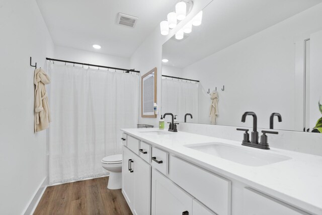 108 Model Ct, Columbia, TN 38401 - full bathroom featuring toilet, double vanity, wood finished floors, a shower with curtain, and recessed lighting
