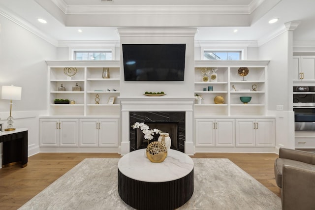 2143 White Poplar Ct, Murfreesboro, TN 37130 - living room featuring light wood-type flooring, crown molding, a fireplace, plenty of natural light, and recessed lighting