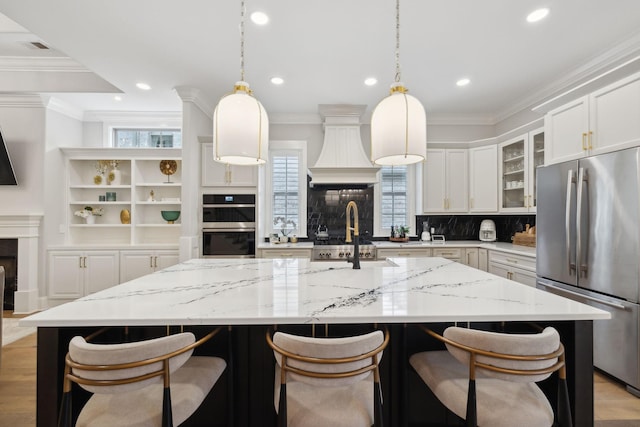 2143 White Poplar Ct, Murfreesboro, TN 37130 - kitchen featuring freestanding refrigerator, a sink, double wall oven, plenty of natural light, and recessed lighting