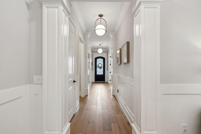 2143 White Poplar Ct, Murfreesboro, TN 37130 - corridor with ornamental molding, light wood-style floors, a decorative wall, and a wainscoted wall