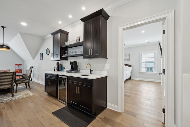 2143 White Poplar Ct, Murfreesboro, TN 37130 - indoor wet bar featuring beverage cooler, crown molding, light wood-type flooring, recessed lighting, and baseboards