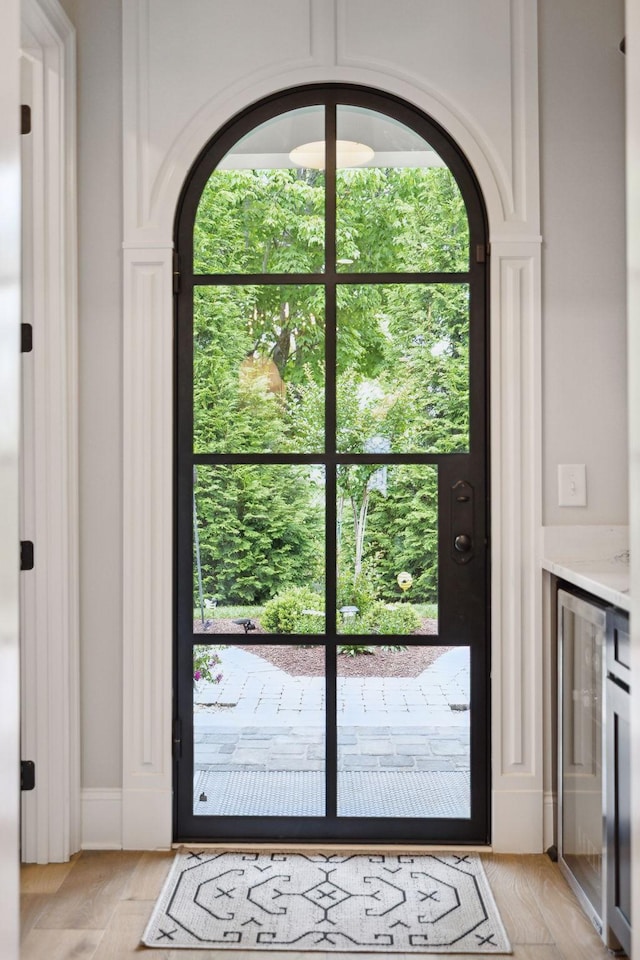 2143 White Poplar Ct, Murfreesboro, TN 37130 - doorway to outside featuring arched walkways, wine cooler, and plenty of natural light