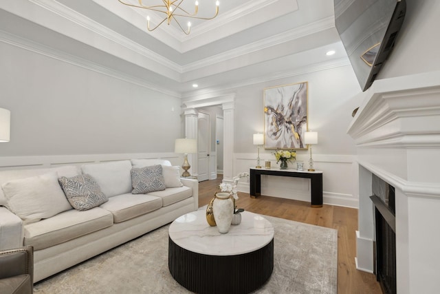 2143 White Poplar Ct, Murfreesboro, TN 37130 - living area featuring wood finished floors, a chandelier, recessed lighting, a fireplace, and wainscoting